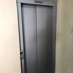 Envelopamento de Porta de Elevador - Inox Escovado - Tatuapé - São Paulo